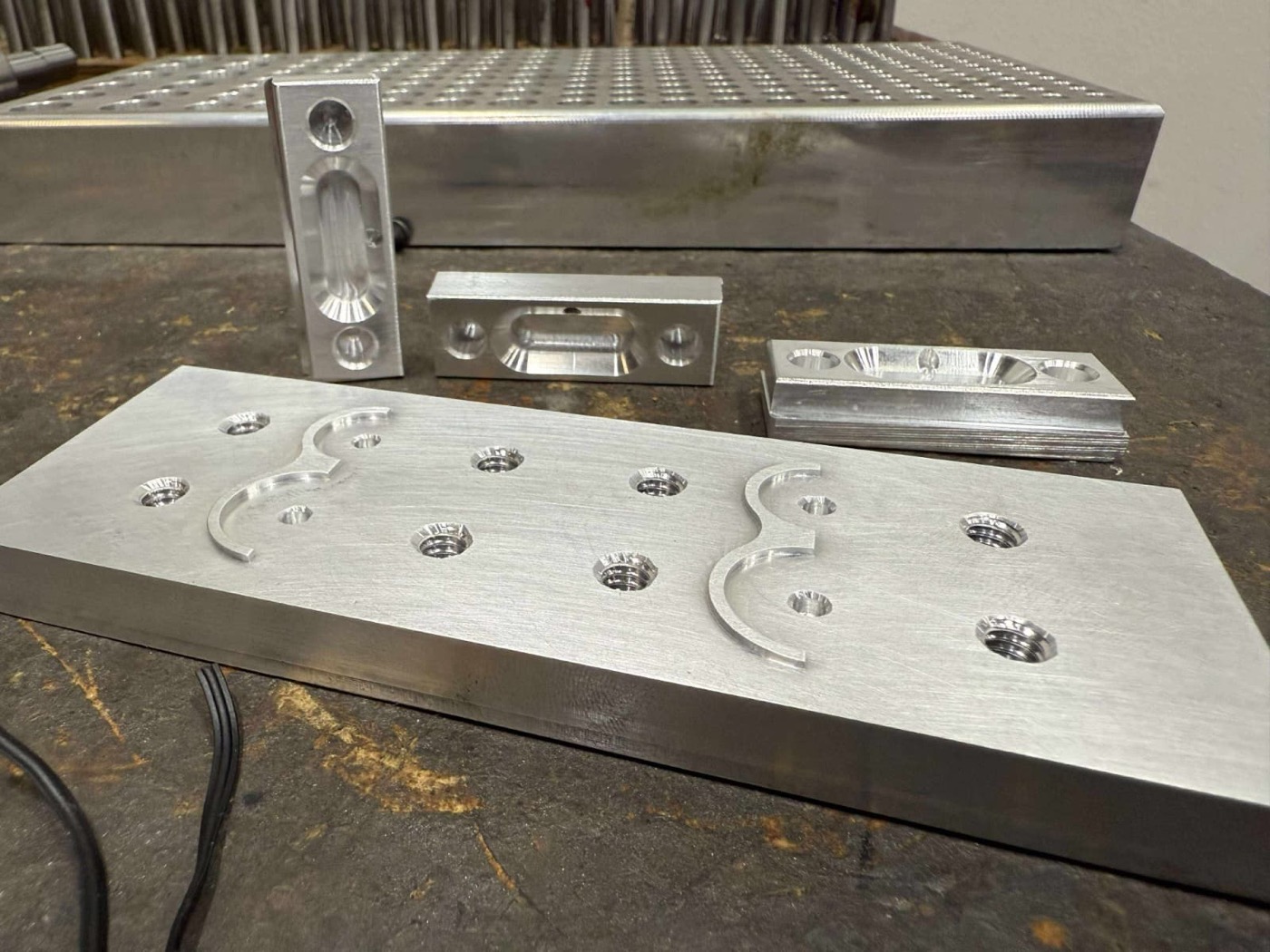 Precision-machined aluminum plates, brackets, and housings