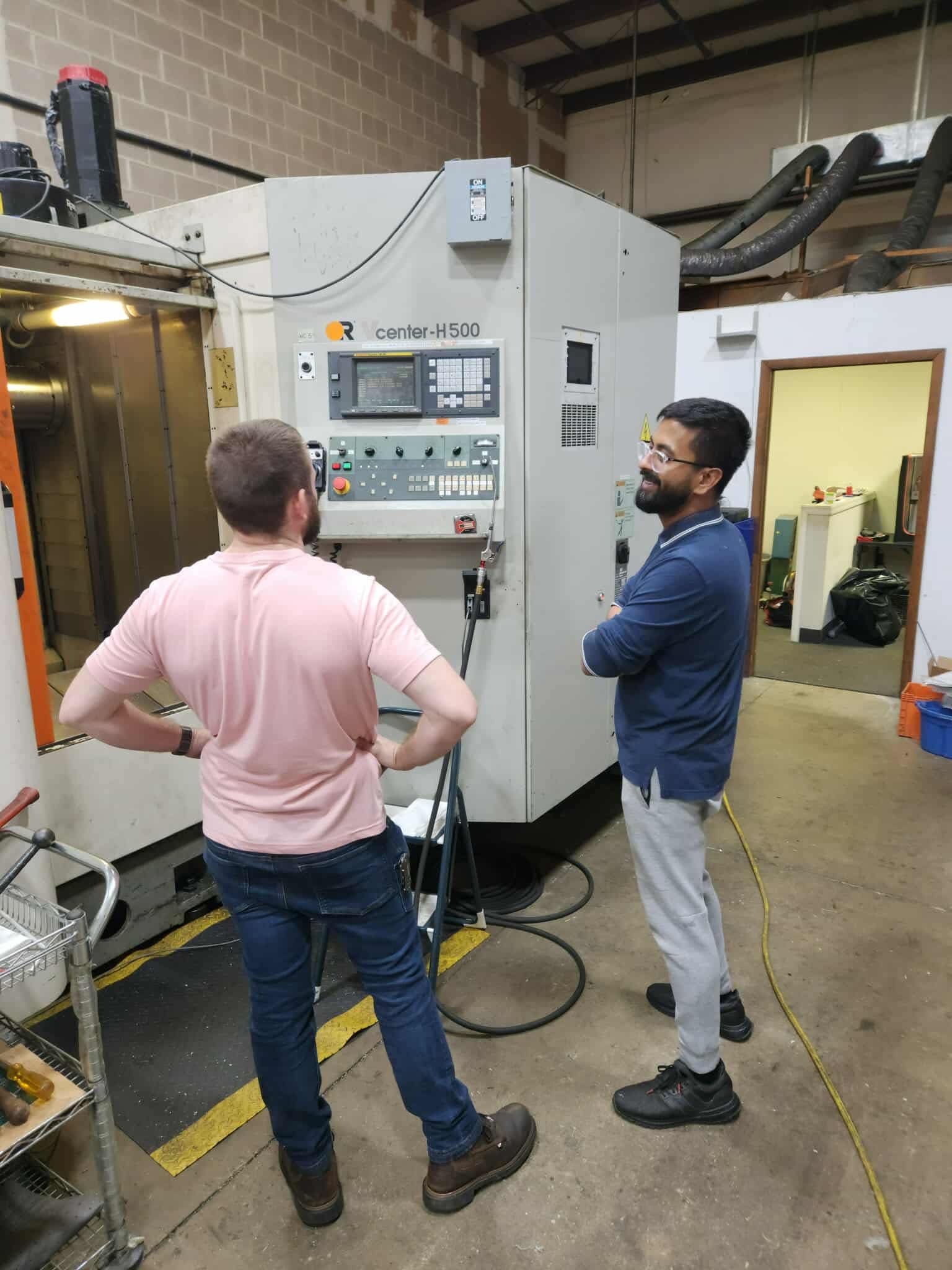 Montgomery Precision founders at the control of the Fortune HV500 horizontal machining center
