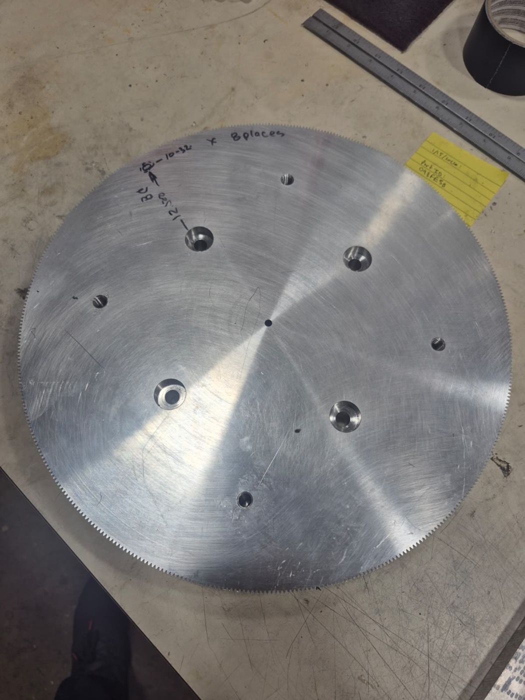 Large machined aluminum gear blank with a toothed edge