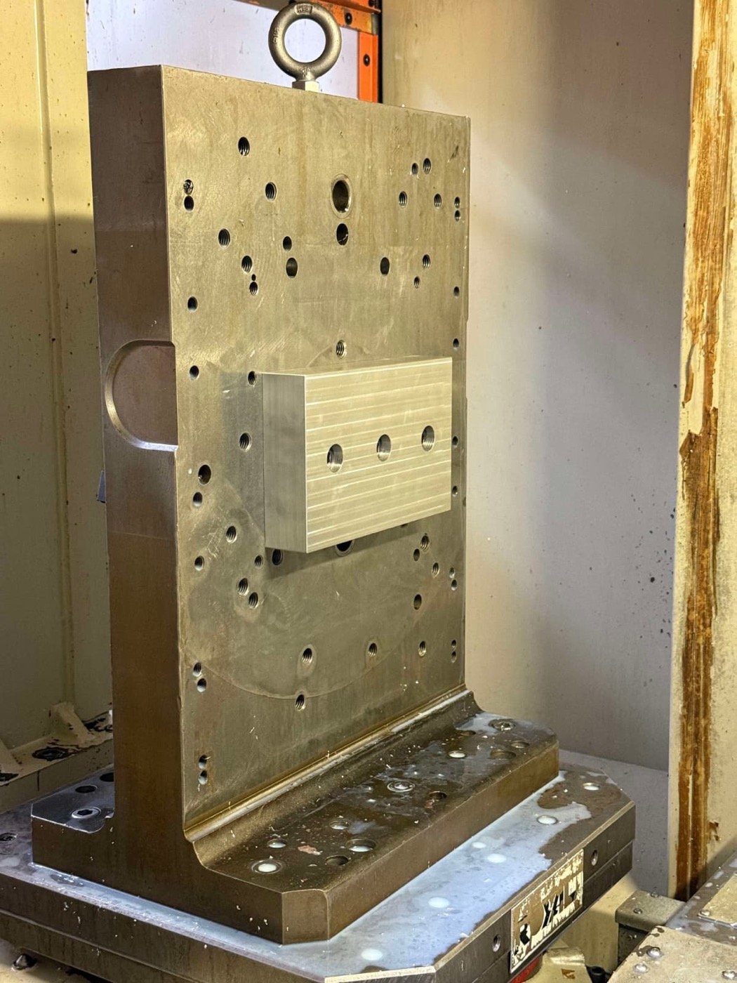 Aluminum block fixtured on a tombstone inside the horizontal machining center