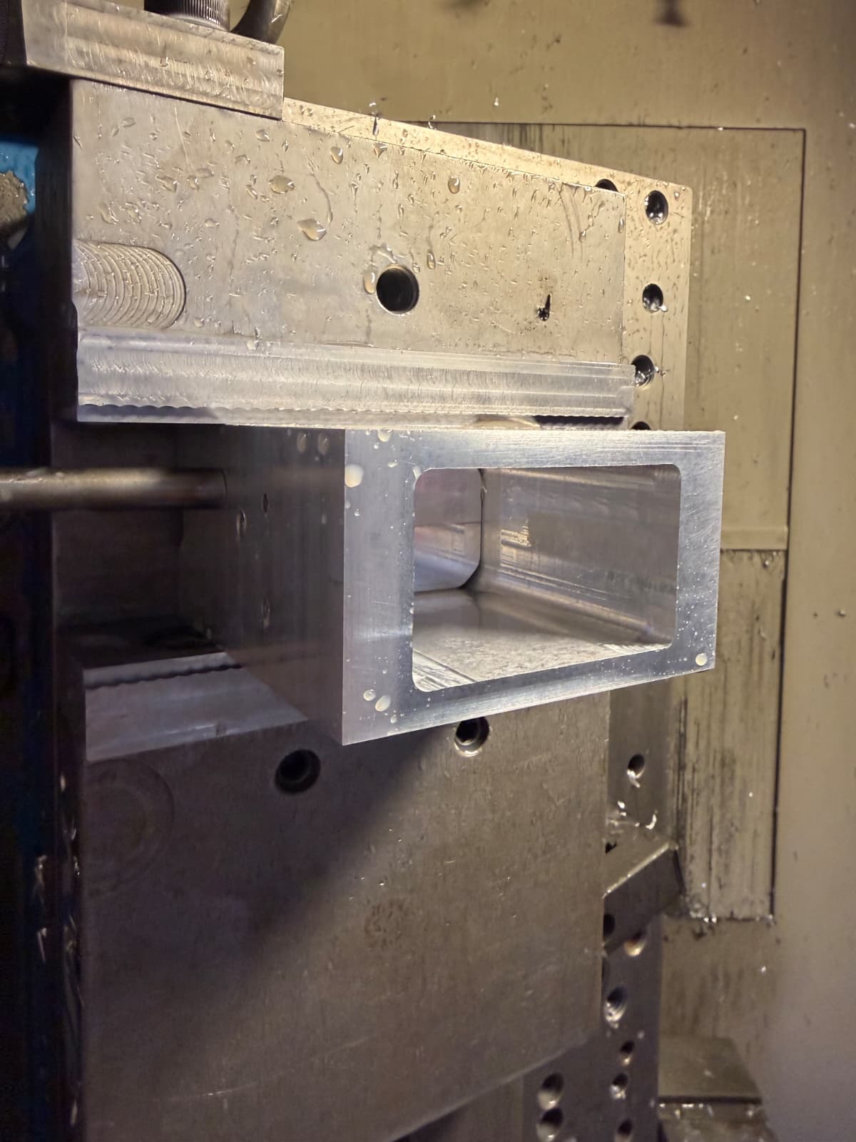 Milled aluminum housing with a precision pocket