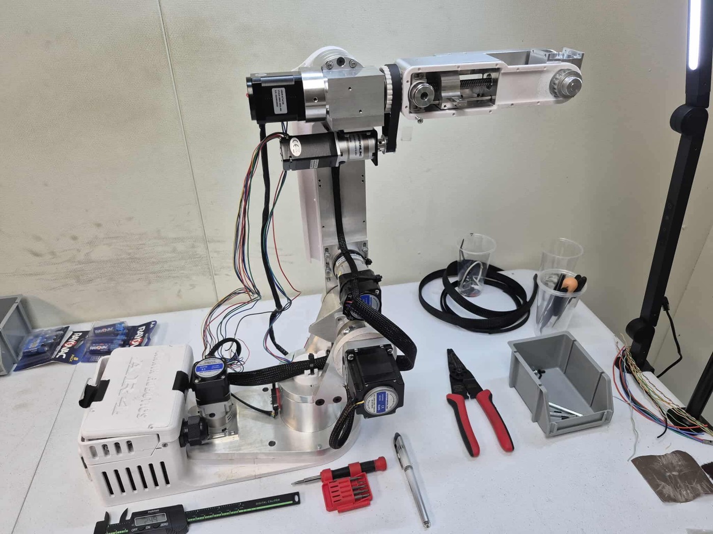 Six-axis robotic arm under development on a Montgomery Precision workbench