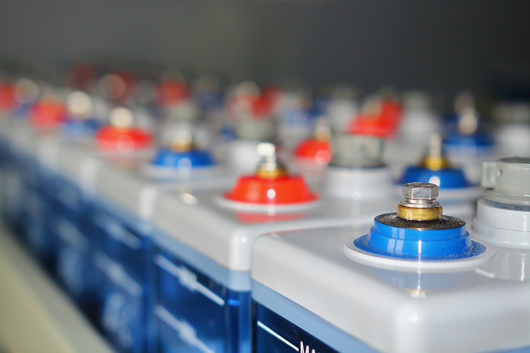 Rows of battery modules with red and blue terminals