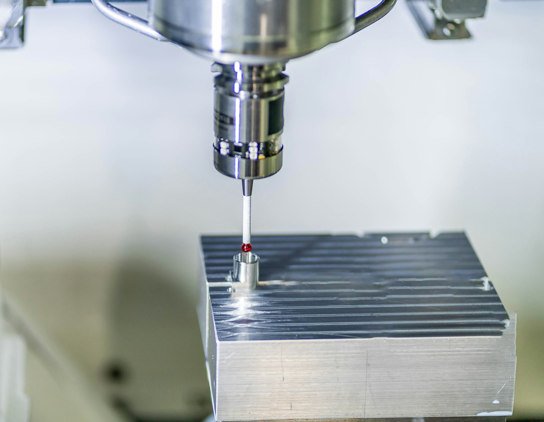 Aluminum block being machined on a vertical CNC mill