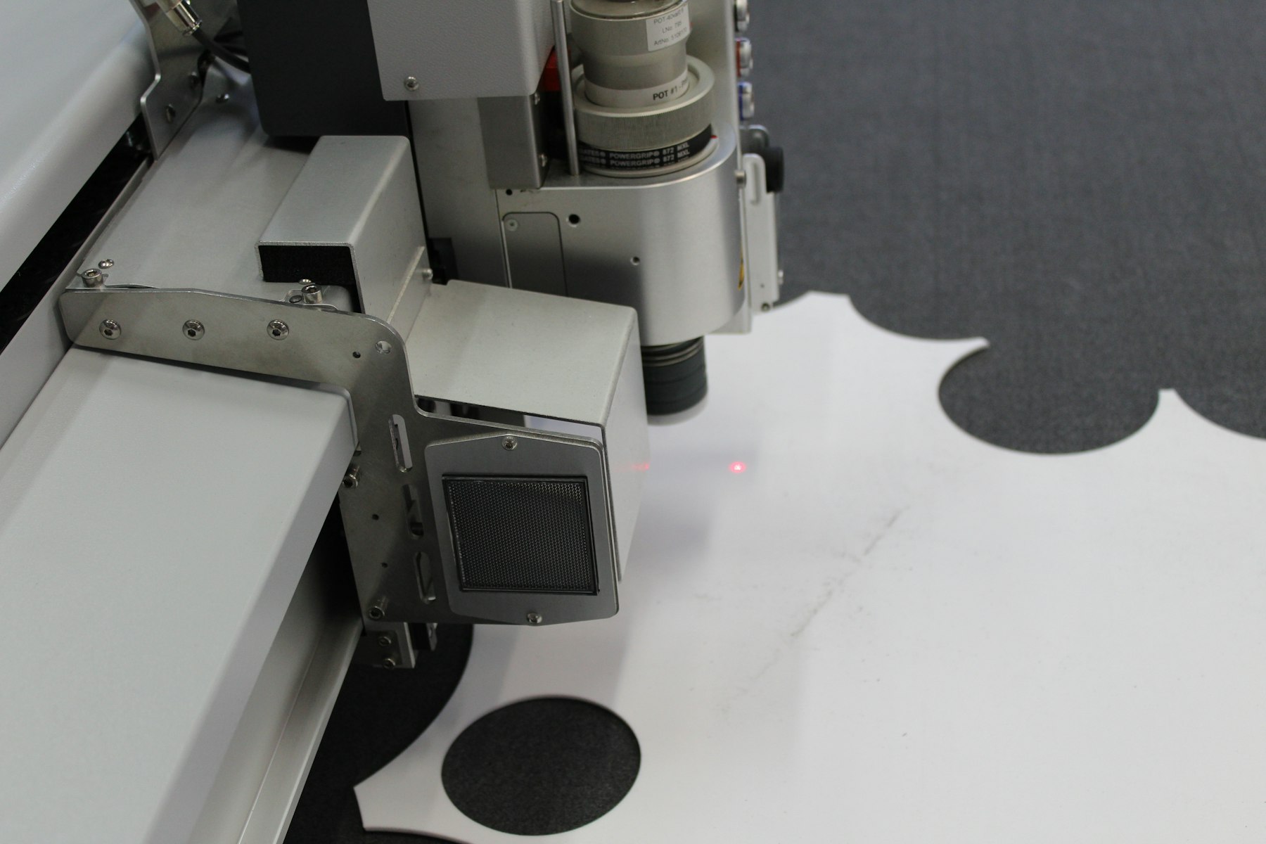 Coordinate measuring machine probe head over a measuring table