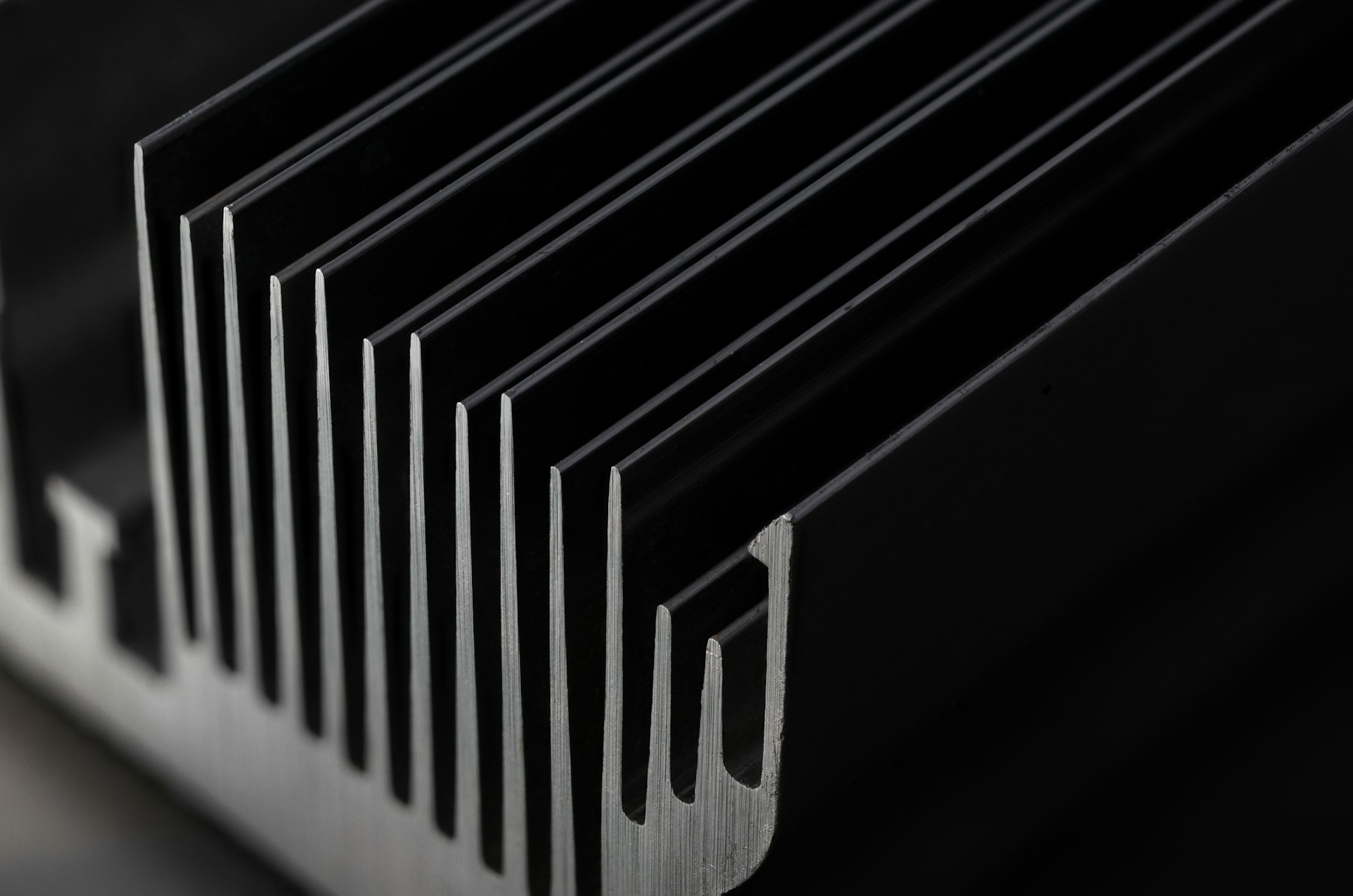 Black anodized extruded heat sink, close-up of the fins