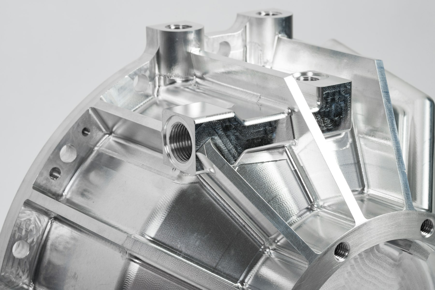 Machined aluminum component with pockets and tapped holes